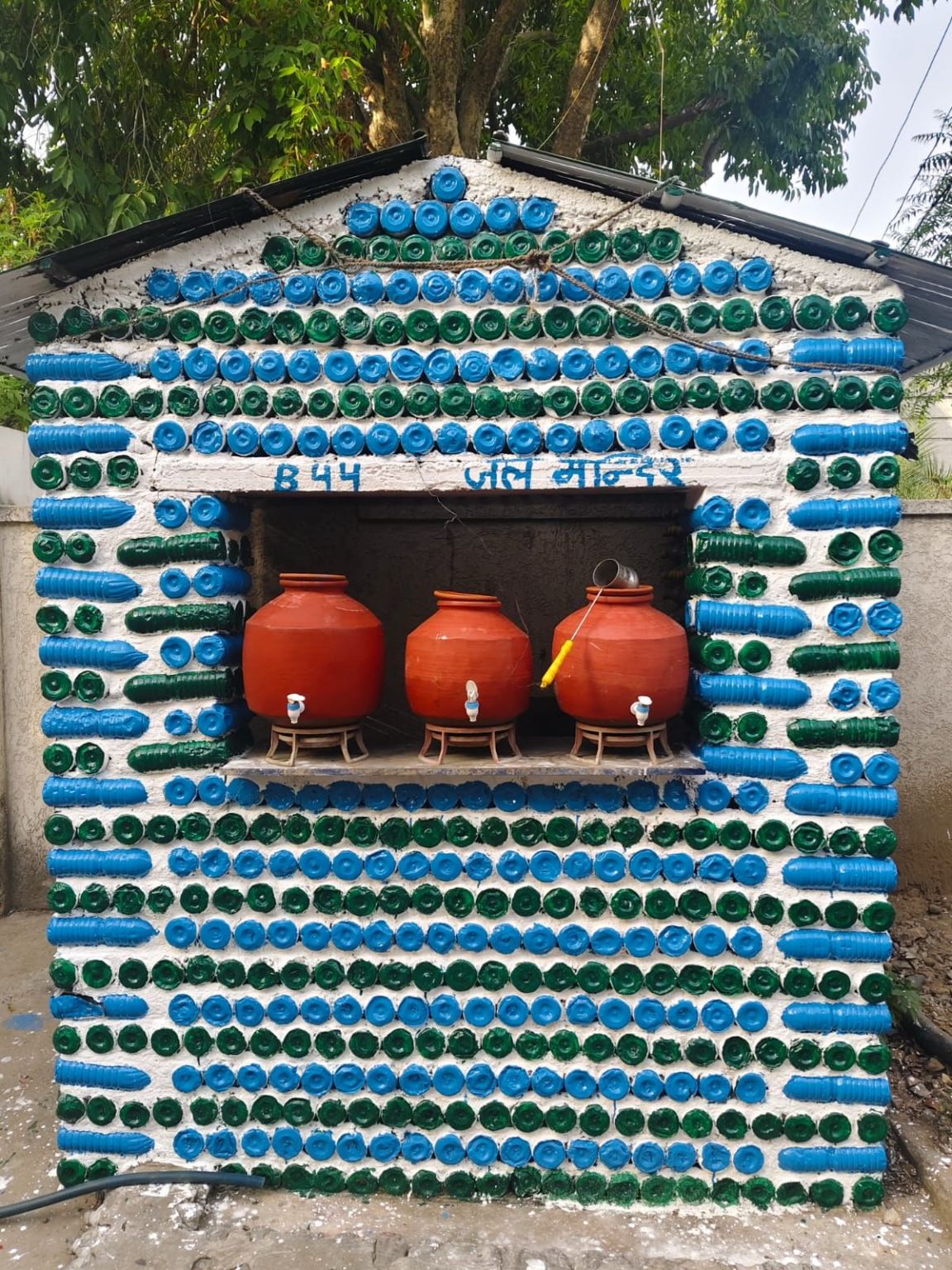 PlastiBuild community water station made with reused plastic bottles